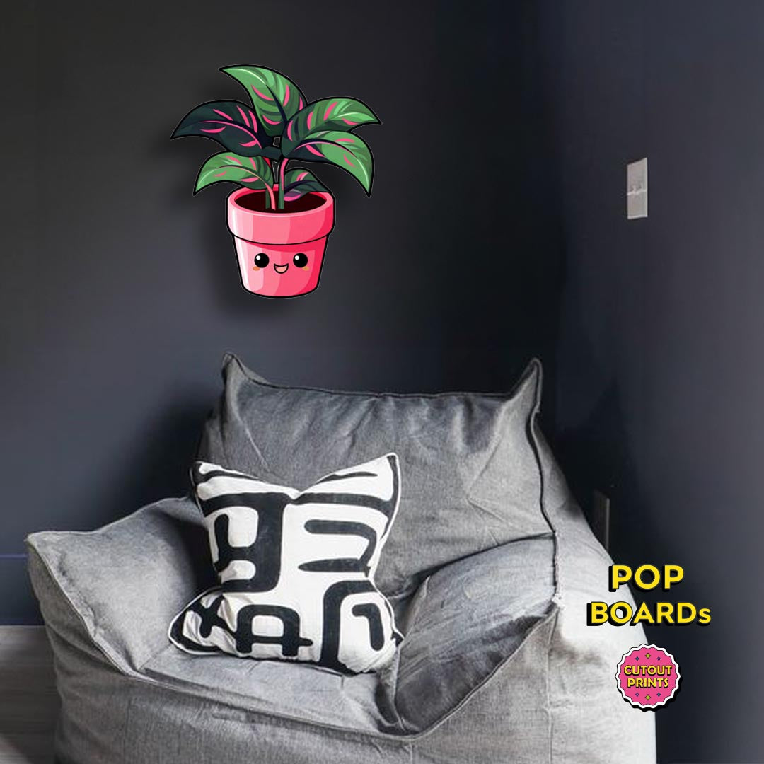 Pink and green leaf plant with red pot